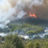 Slika od Požar na Solinu nedaleko od kuća, iz daljine vidljiv plamen