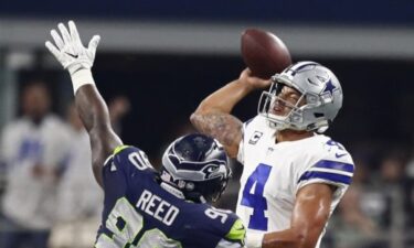 Slika od Quarterback Dallas Cowboysa postao najbolje plaćeni igrač u povijesti NFL-a